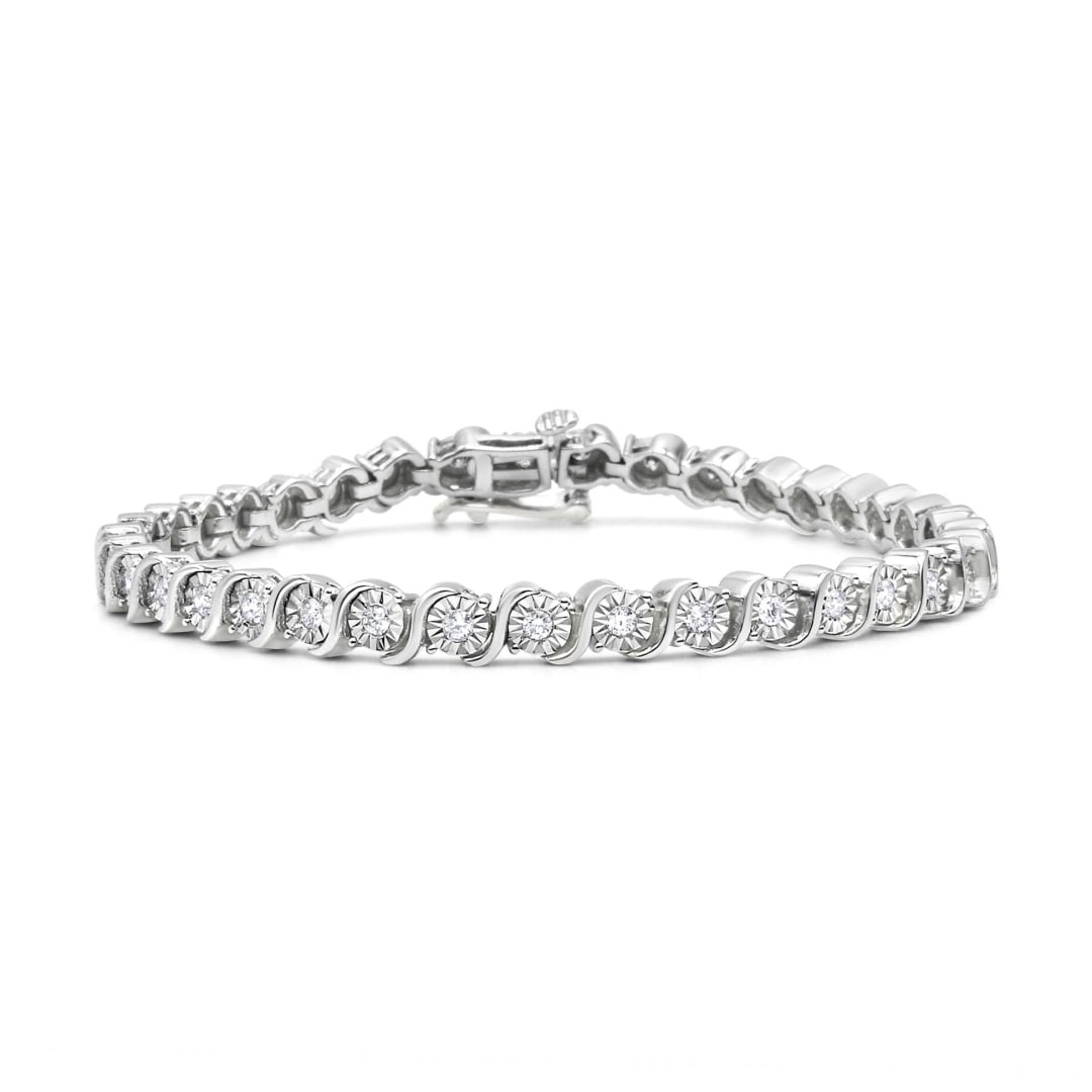 Elegant .25ct Diamond S-link Tennis Bracelet: Length: 7". This exquisite bracelet features 37 natural round-cut diamonds, totaling 0. 25 carats, beautifully set using the miraculous technique. With a clarity grade of i2-i3 and a color range of i-