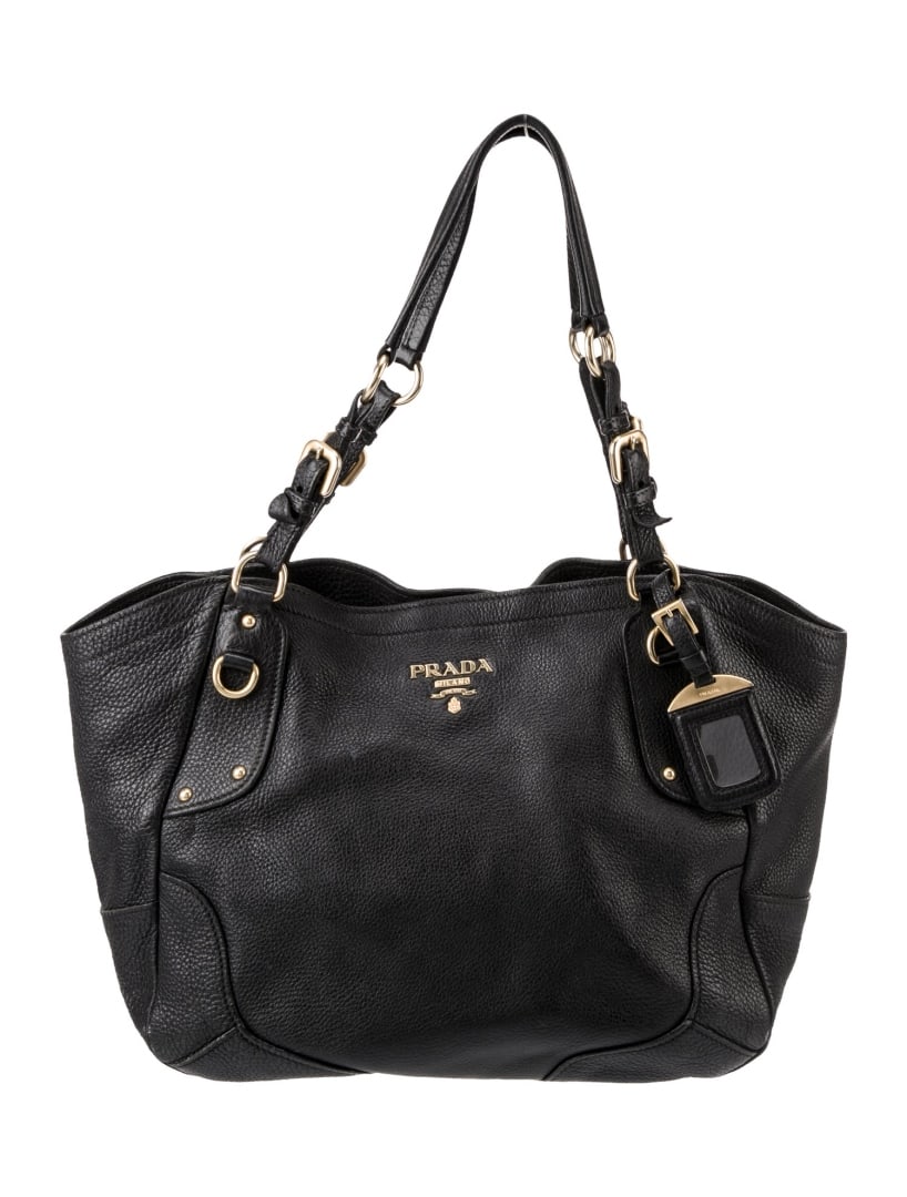 Prada Vitello Daino Phenix Vitello Leather Hdl Bag: Condition is good, pre-owned. Details: nero & nero vitello daino leather, gold-tone hardware, single adjustable shoulder strap, logo jacquard lining & dual interior pockets, snap closure at top, prote