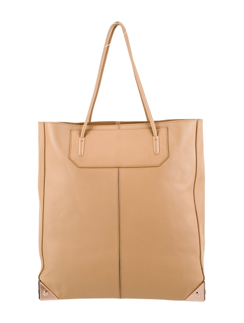 Alexander Wang Neutrals Leather Open Top Tote: Condition is good, pre-owned. Details: neutrals leather, rose gold-tone hardware, rolled handles & dual shoulder straps, suede lining & dual interior pockets, open top, protective feet at base, should