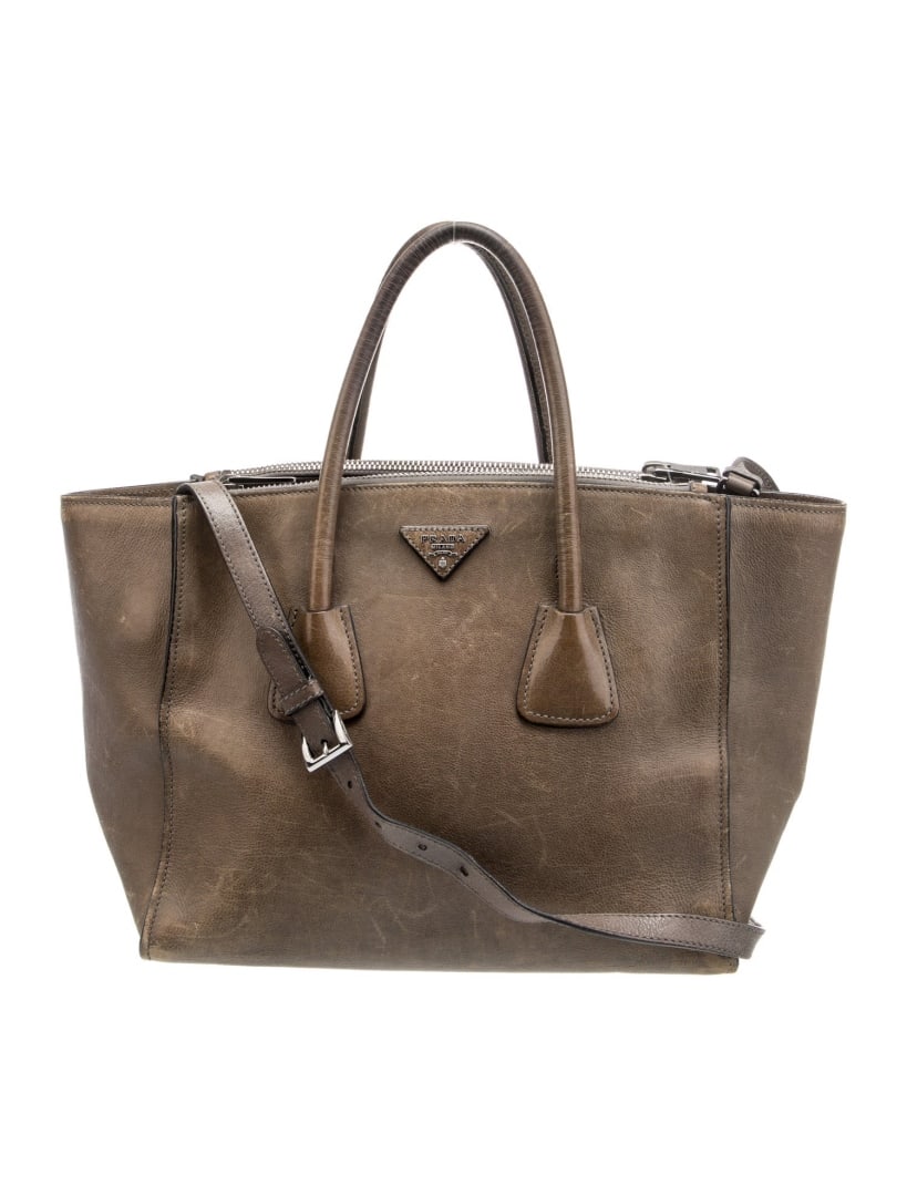 Prada Twin Pocket Marmo Glace Calf Leather Tote: Condition is very good, pre-owned. Details: marmo glace calf leather, silver-tone hardware, rolled handles & single adjustable shoulder strap, leather trim embellishment & dual exterior pockets, logo