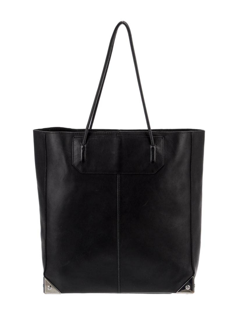 Alexander Wang Leather Silver-tone Open Top Tote: Condition is good, pre-owned. Details: black leather, silver-tone hardware, dual shoulder straps, unlined & dual interior pockets, open top, protective feet at base, shoulder strap drop: 8. 25", heigh