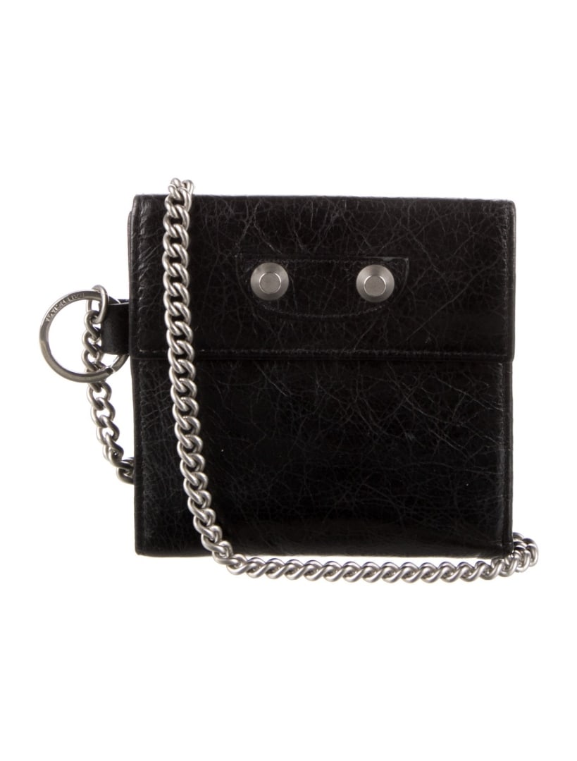 Balenciaga Black Leather Silver-tone Hdw Wristlet: Condition is very good, pre-owned. Details: from the fall/winter 2014 collection by alexander wang, black leather, silver-tone hardware, nylon lining & seven interior pockets with card slots, snap clo