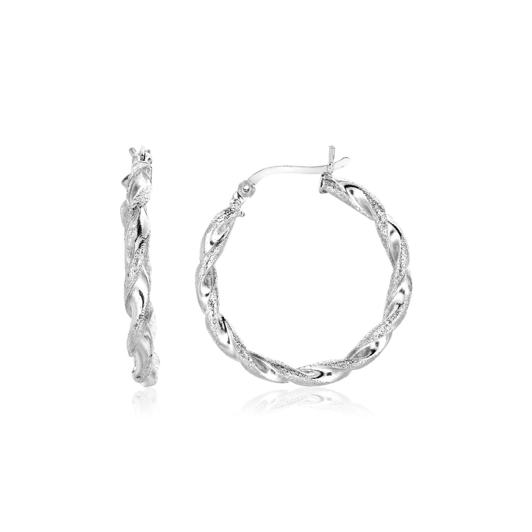 Sterling Silver Round Twisted Hoop Earrings: Gorgeous sterling silver is polished and twisted into classic round hoops to create these gorgeous earrings. Earrings are 20mm in diameter and are held in place by hinged clasps. Earring information: 