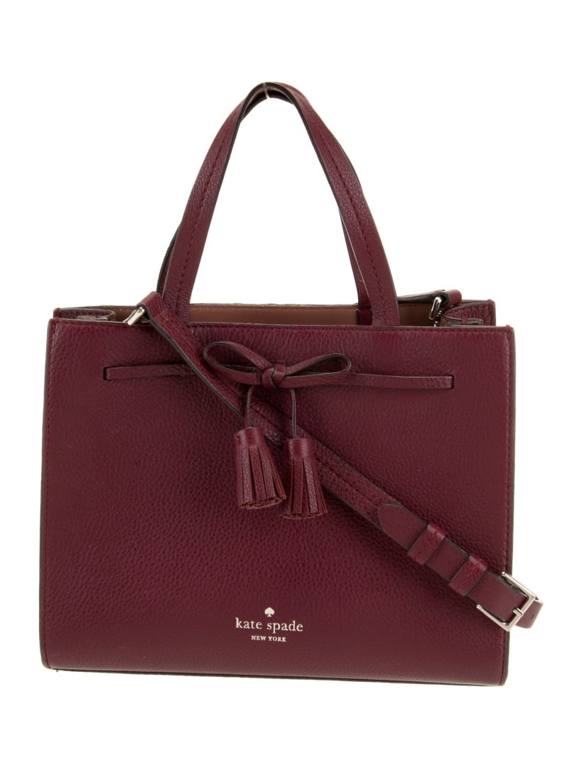 Kate Spade Burgundy Leather Tassel Top Hdl Bag: Condition is good, pre-owned. Details: burgundy leather, gold-tone hardware, flat handles & single adjustable shoulder strap, tassel accents, leather lining, open top, protective feet at base, shoulde