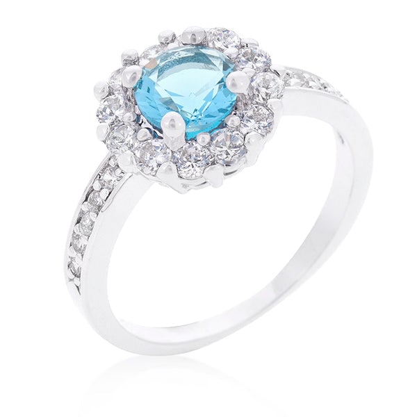 Mesmerizing .88ct Aquamarine & Topaz Halo Ring: Size 7. Featuring a refined 2 mm band width. Made from eco-friendly lead-free alloy (brass) and plated with lustrous rhodium, it blends beauty with sustainability. Measuring 22 mm in length, 11 mm in