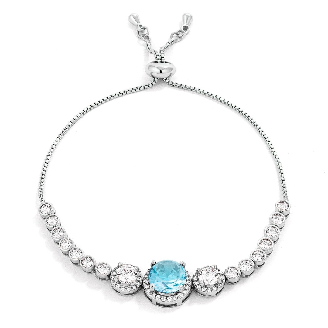 Round 5.95ct Aquamarine & White Topaz Bracelet: Length: 8. 5". Features a round light aquamarine gemstone at its center. The aquamarine has a lovely blue hue that is accentuated by the sparkling white topaz gemstones that surround it. The gemstones