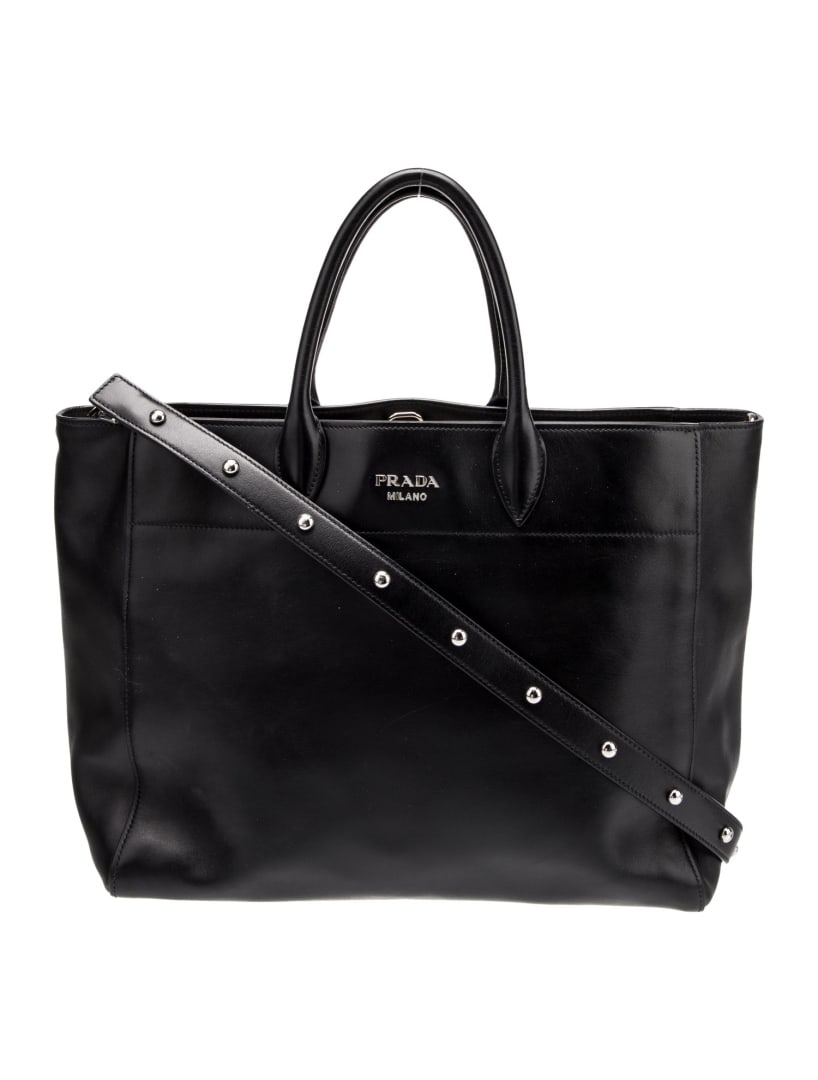 Prada Nero City Calf Leather Snap Crossbody Bag: Condition is: very good, pre-owned. Details: by miuccia prada, nero city calf leather, silver-tone hardware, rolled handles, logo jacquard lining & three interior pockets, snap closure at top shoulder