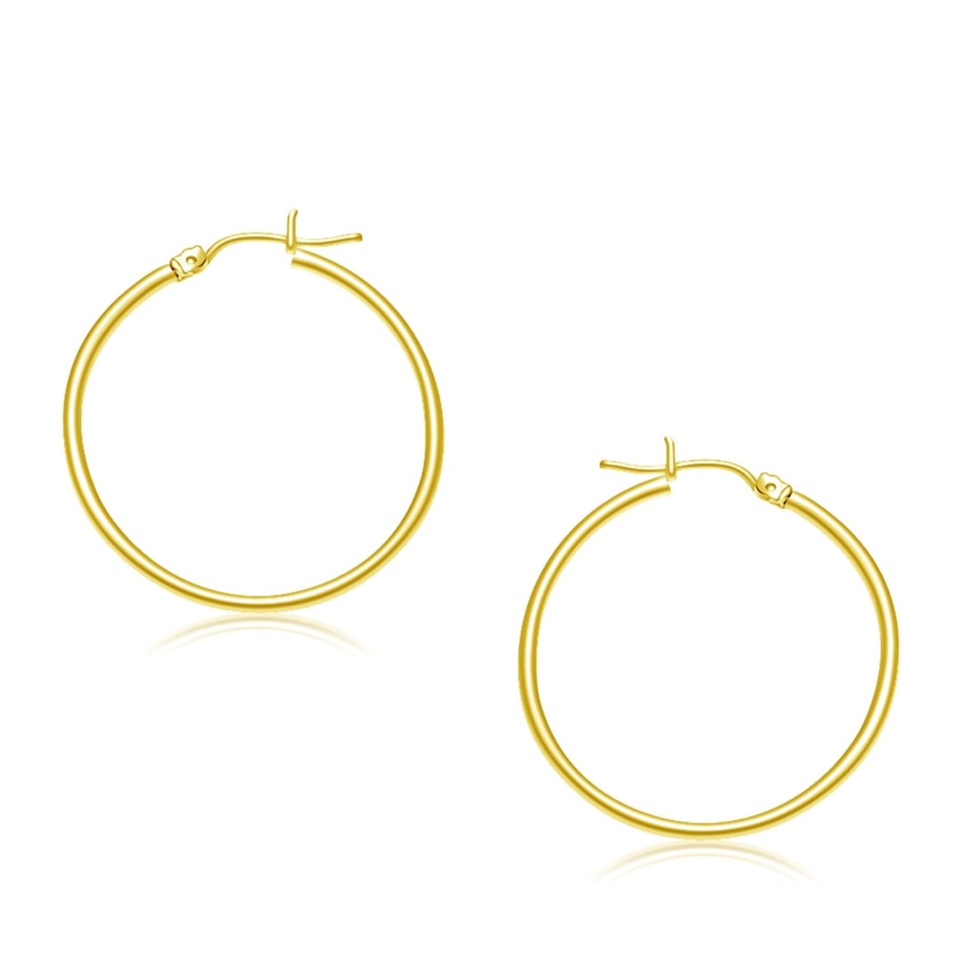 14k Gold Polished Hoop Earrings 30mm: These timeless hoop earrings are crafted in 14k gold and measure 30 millimeters in diameter, featuring a snap lock backing. Earring information: length: 1. 18 inches, width: 0. 08 inches, diameter: 1.