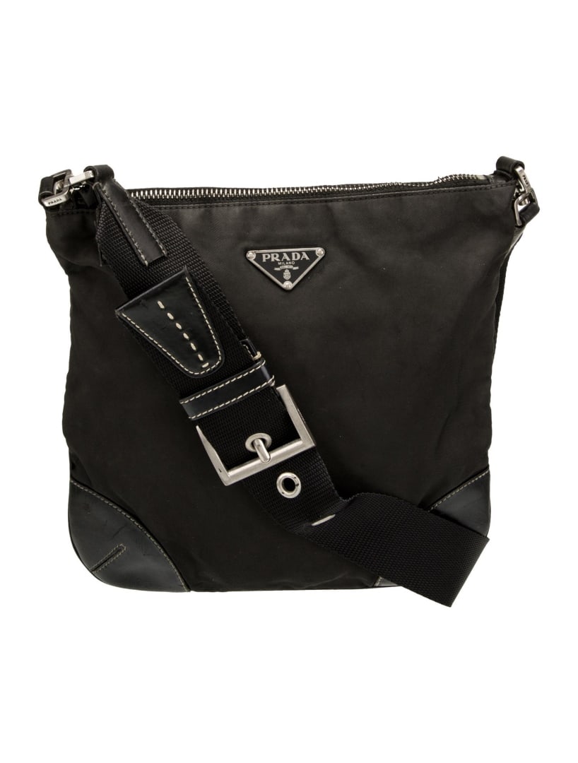 Prada Nero Tessuto Vela Nylon Zip Messenger Bag: Condition is good, pre-owned. Details: nero tessuto, tessuto nylon & enameled metal triangle, silver-tone hardware, leather trim, single adjustable shoulder strap, leather trim embellishment, logo jac