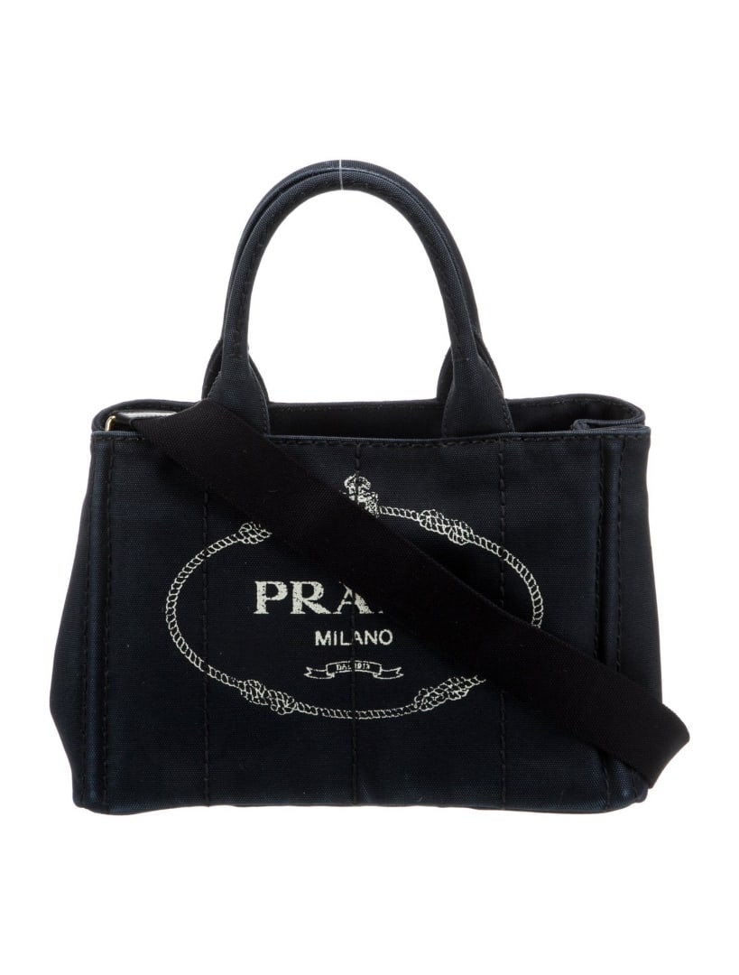 Prada Blue Canvas Graphic Snap Cls Top Handle Bag: Condition is: very good, pre-owned. Details: blue canvas, graphic print, gold-tone hardware, canvas lining & three interior pockets, snap closure at side, protective feet at base, handle drop: 5", hei