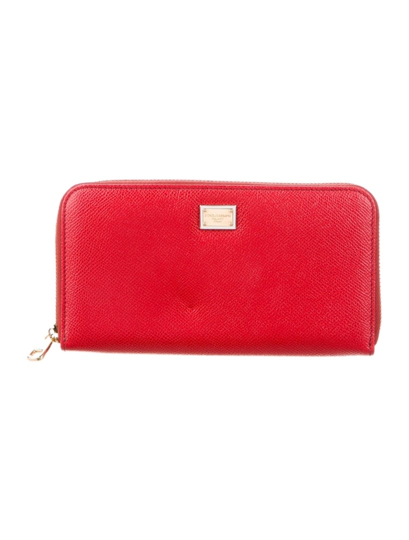 Dolce & Gabbana Red Leather Zip Continental Wallet: Condition is very good, pre-owned. Details: from the fall/winter 2014 collection by alexander wang, black leather, silver-tone hardware, nylon lining & seven interior pockets with card slots, snap clo