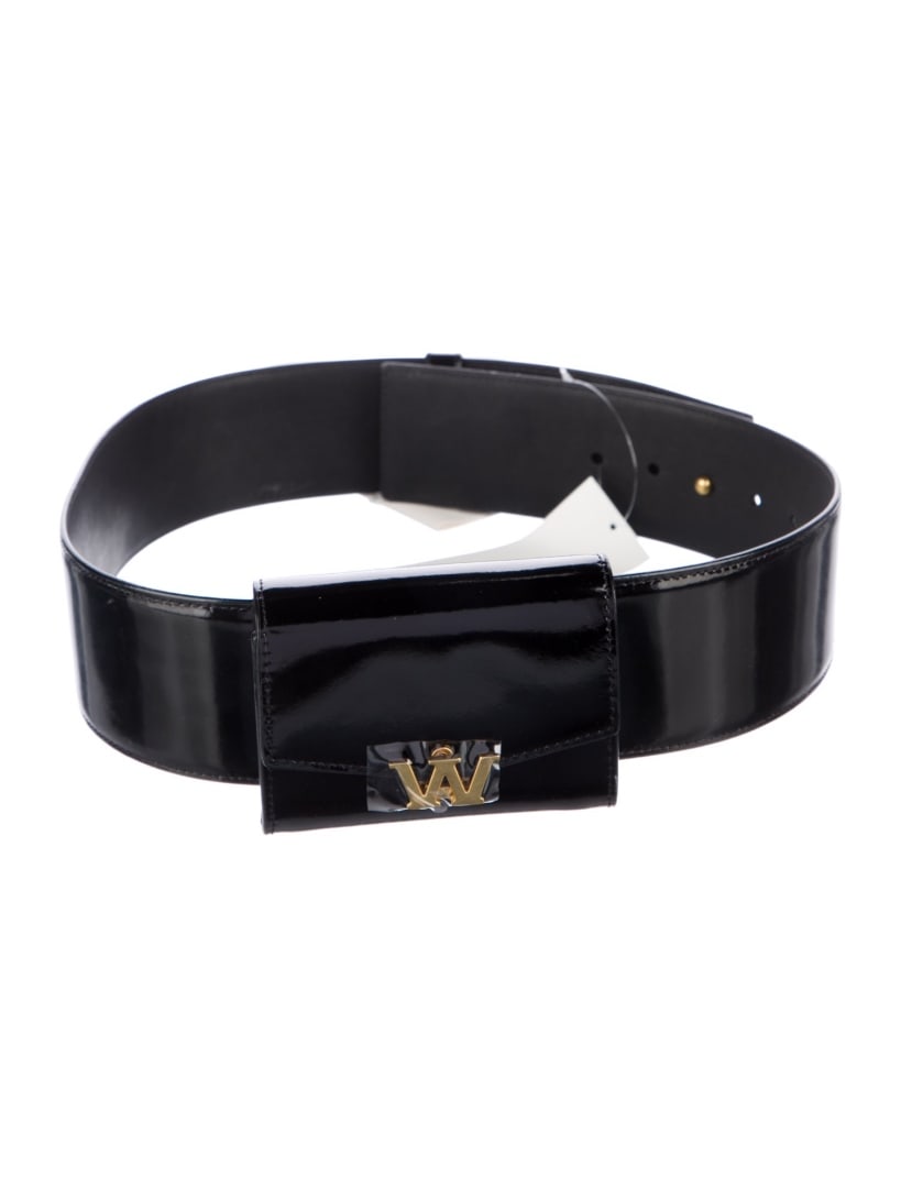 Alexander Wang Black Patent Leather Flap Belt Bag: Condition is very good, pre-owned. Details: black patent leather, gold-tone hardware, adjustable waist strap, leather lining, flap closure at front, length min: 20", length max: 20", width: 0. 25", ge