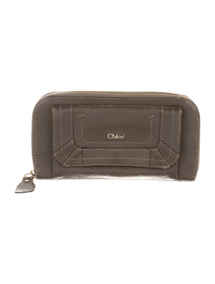 Chloe Brown Leather Exposed Zip Continental Wallet: Condition is: good, pre-owned. Details: brown leather, gold-tone hardware, single exterior pocket, nylon lining & three interior pockets with card slots, exposed zip closure, height: 4", width: 7", de