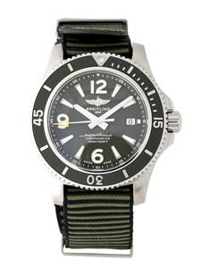 Breitling Superocean Outerknown Auto Men's 44mm: Condition is good, pre-owned. Details: green dial, tang buckle, fits a wrist size of 7. 75" or smaller, collection: superocean, model name: outer known, serial number: 72*****, production year: circa