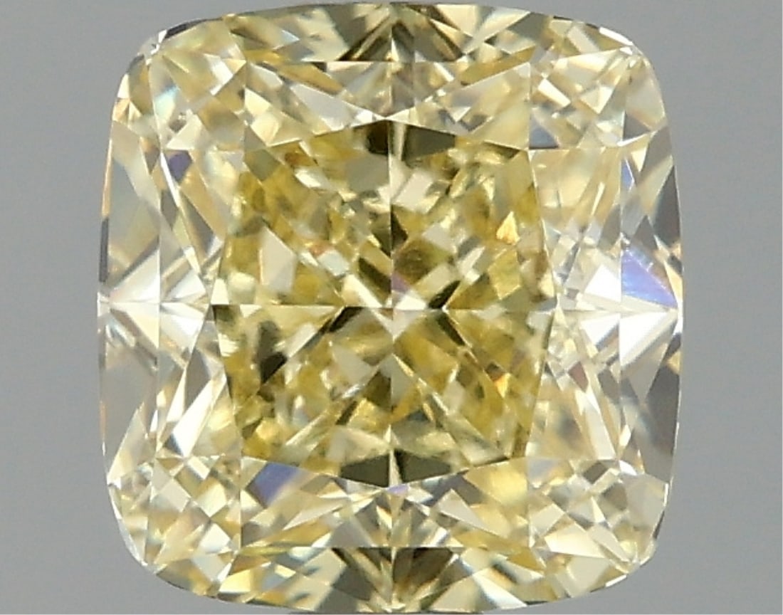 Fancy Yellow Cushion Cut 1.59ct Vvs2 Lab Diamond: This igi-certified lab-grown cushion-cut diamond weighs 1. 59 carats and features a fancy light yellow color with vvs2 clarity. It has excellent polish and excellent symmetry with no fluorescence, the