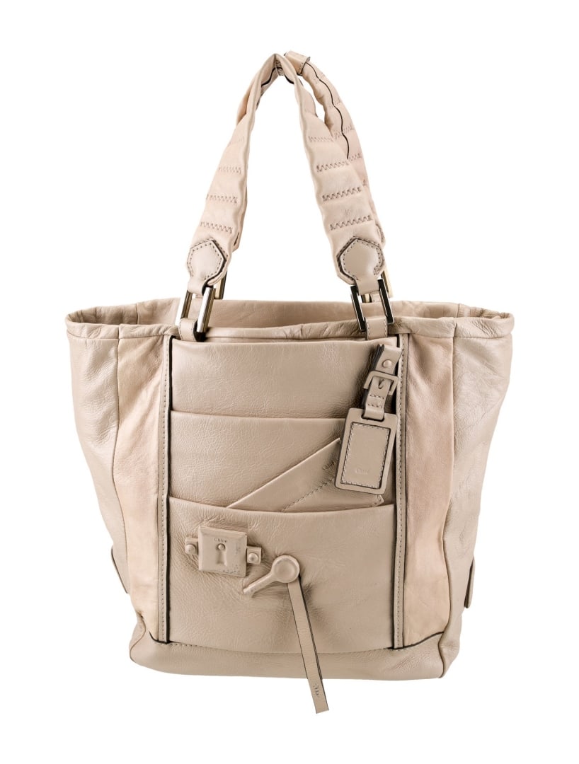 Chloe Neutrals Leather Multitonal Hdw Zip Cls Tote: Condition is: good, pre-owned. Details: neutrals leather, multitonal hardware, flat handles & dual shoulder straps, dual exterior pockets, canvas lining & single interior pocket, zip closure at top, s