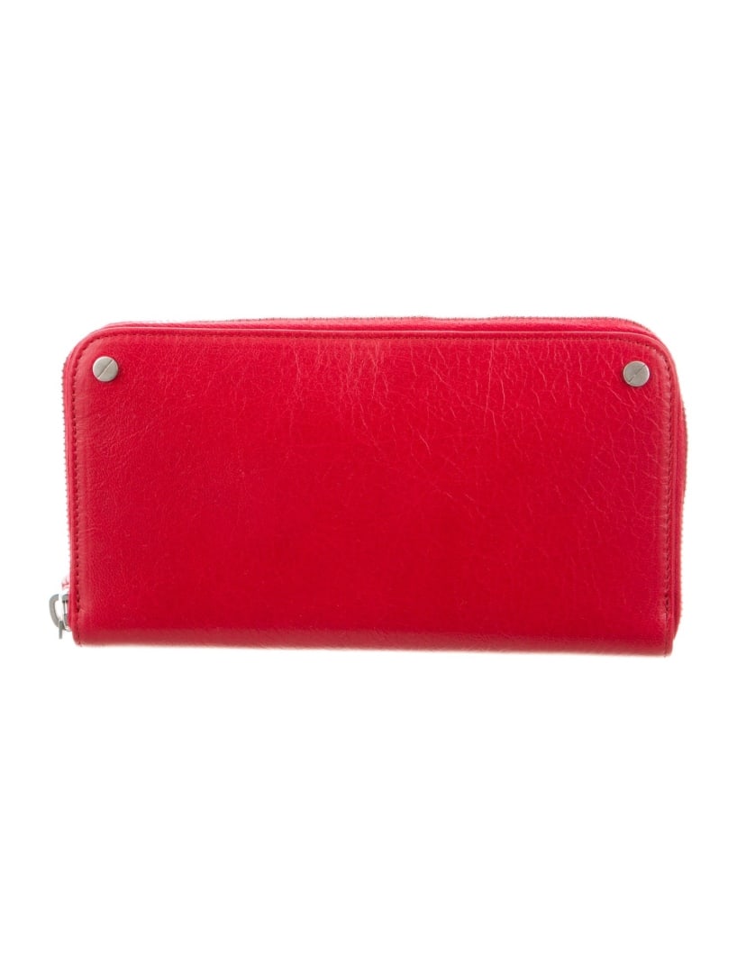 Balenciaga Red Leather Studded Continental Wallet: Condition is very good, pre-owned. Details: from the spring/summer 2018 collection by demna gvasalia, red leather, silver-tone hardware, studded accents, leather lining & single interior pocket with c
