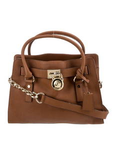 Michael Kors Saffiano Leather Turn-lock Shldr Bag: Condition is very good, pre-owned. Details: brown saffiano leather, gold-tone hardware, rolled handles & chain-link shoulder strap, chain-link accents, logo jacquard lining & three interior pockets, t
