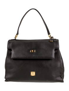 Mcm Black Leather Turn-lock Cls Top Hdl Bag: Condition is: good, pre-owned. Details: vintage, black leather, gold-tone hardware, flat handle, leather lining & dual interior pockets, turn-lock closure at front, protective feet at base, includes