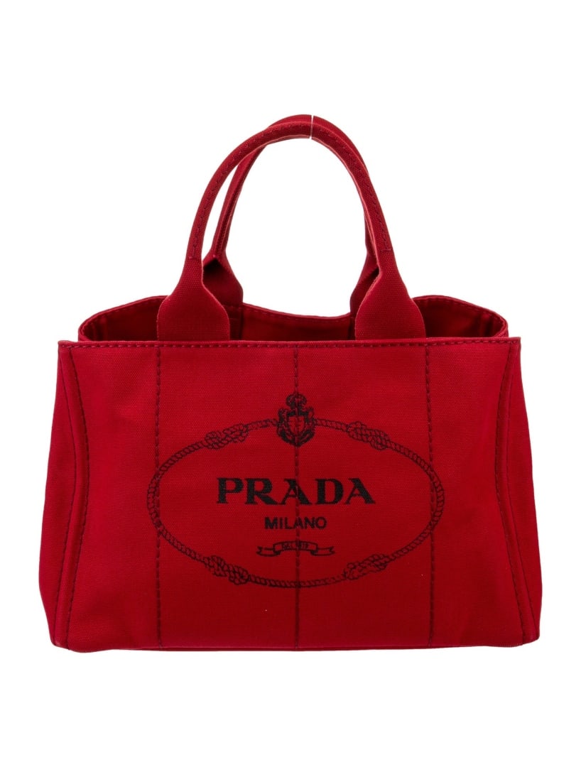 Prada Canapa Red Canvas Graphic Print Canapa Tote: Condition is: very good, pre-owned. Details: red canvas, graphic print, canapa, gold-tone hardware, flat handles, canvas lining & five interior pockets, open top, protective feet at base, includes dus