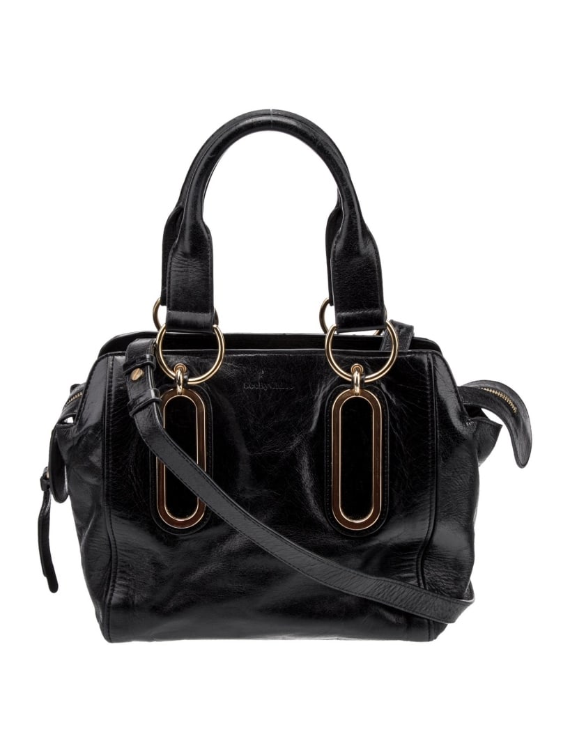 See By Chloe Blk Leather Zip Cls Top Hdl Bag: Condition is: very good, pre-owned. Details: black leather, gold-tone hardware, rolled handles & single shoulder strap, canvas lining & three interior pockets, zip closure at top, protective feet at b