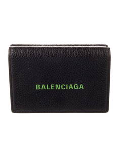 Balenciaga Black Leather Snap Compact Wallet: Condition is: very good, pre-owned. Details: from the 2021 collection by demna gvasalia, black leather, printed, silver-tone hardware, leather lining with card slots, snap closure, height: 3", width: