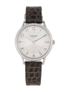 Hermes Slim D'hermes Ss Silver Dial Women's 32mm: Condition is good, pre-owned. Details: silver dial, tang buckle, fits a wrist size of 6. 25" or smaller, collection: slim d'hermes, serial number: 32*****, movement: quartz, case shape: round, case ma