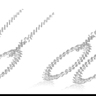 Round .05ct Diamond Oval Rope Drop Earrings: The cable themed oval elements highlighted by the. 05ct diamond embellishments on this chic and stylish drop earrings. Designed in sterling silver with lovely rhodium plating. Earring information: len