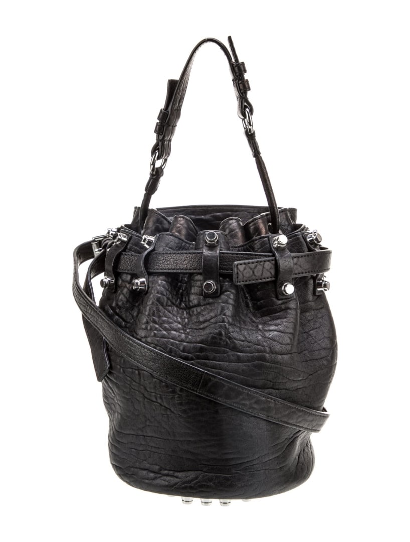 Alexander Wang Blk Leather Studded Bucket Bag: Condition is: very good, pre-owned. Details: black leather, silver-tone hardware, flat handle & single shoulder strap, studded accents & dual exterior pockets, nylon lining & single interior pocket, d