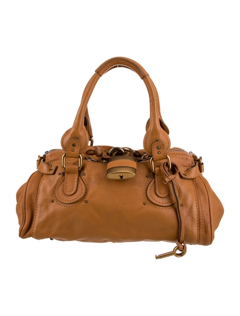 Chloe Vtg Brown Leather Studded Zip Top Hdl Bag: Condition is: good, pre-owned. Details: vintage, brown leather, gold-tone hardware, rolled handles & dual shoulder straps, studded accents & dual exterior pockets, canvas lining & dual interior pocket