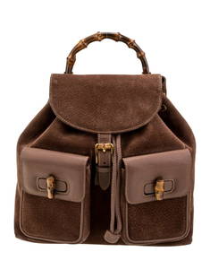 Gucci Suede Large Brown Suede Drawstring Backpack: Condition is: very good, pre-owned. Details: brown suede, gold-tone hardware, leather trim, bamboo handle & dual adjustable shoulder straps, leather trim embellishment, jacquard lining, drawstring clo