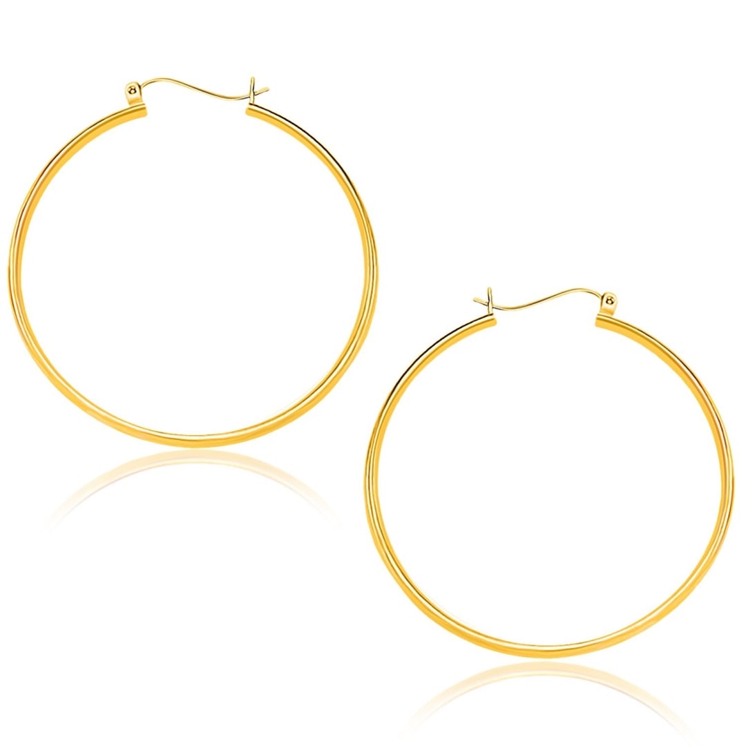 10k Gold Polished Hoop Earrings 40mm: These timeless hoop earrings are crafted in 10k gold and measure 40 millimeters in diameter, featuring a snap lock backing. Earring information: diameter: 40. 00 mm, width: 1. 50 mm, backing: snap loc