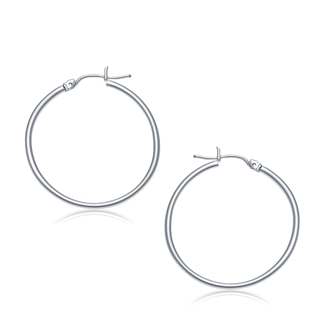 14k White Gold Polished Hoop Earrings: These timeless hoop earrings are crafted in 14k white gold and measure 30 millimeters in diameter, featuring a snap lock backing. Earring information: length: 1. 18 inches, width: 0. 08 inches, diamet