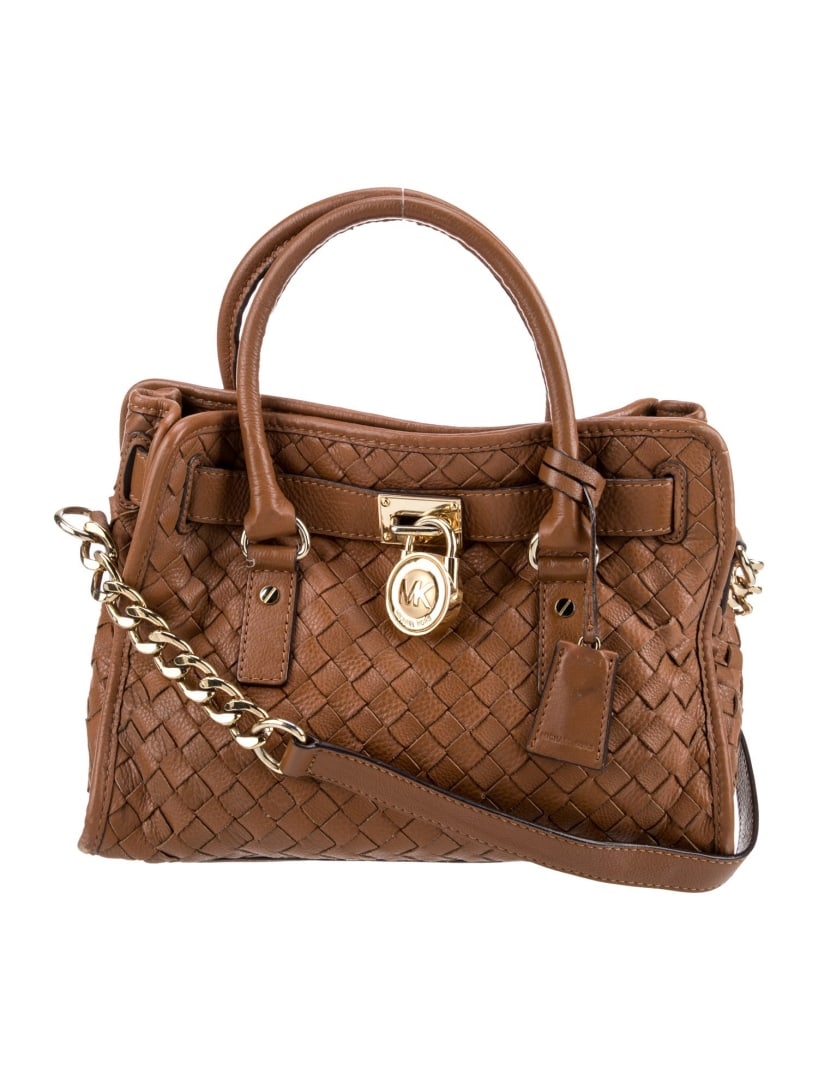 Michael Kors Brown Leather Chain-link Top Hdl Bag: Condition is: good, pre-owned. Details: brown leather, gold-tone hardware, rolled handles & chain-link shoulder strap, chain-link accents, logo jacquard lining & five interior pockets, snap closure at
