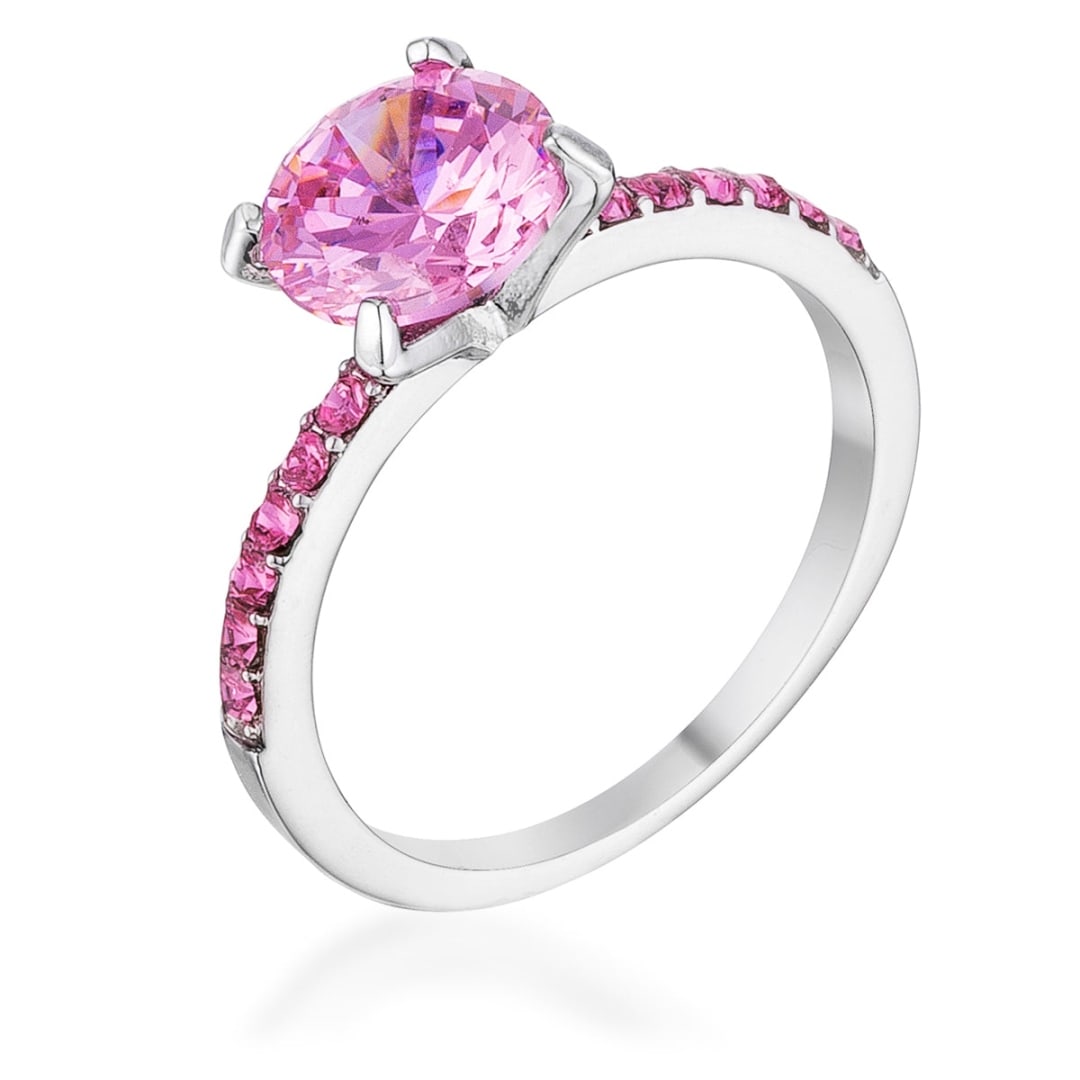 Elegant Round 2.30ct Pink Sapphire Ring: Ring size: 8. This ring features a stunning 8mm round pink sapphire stone, surrounded by pave pink sapphires totaling 2. 30ct. The band, measuring 2 mm in width, is crafted from a lead-free alloy (bra