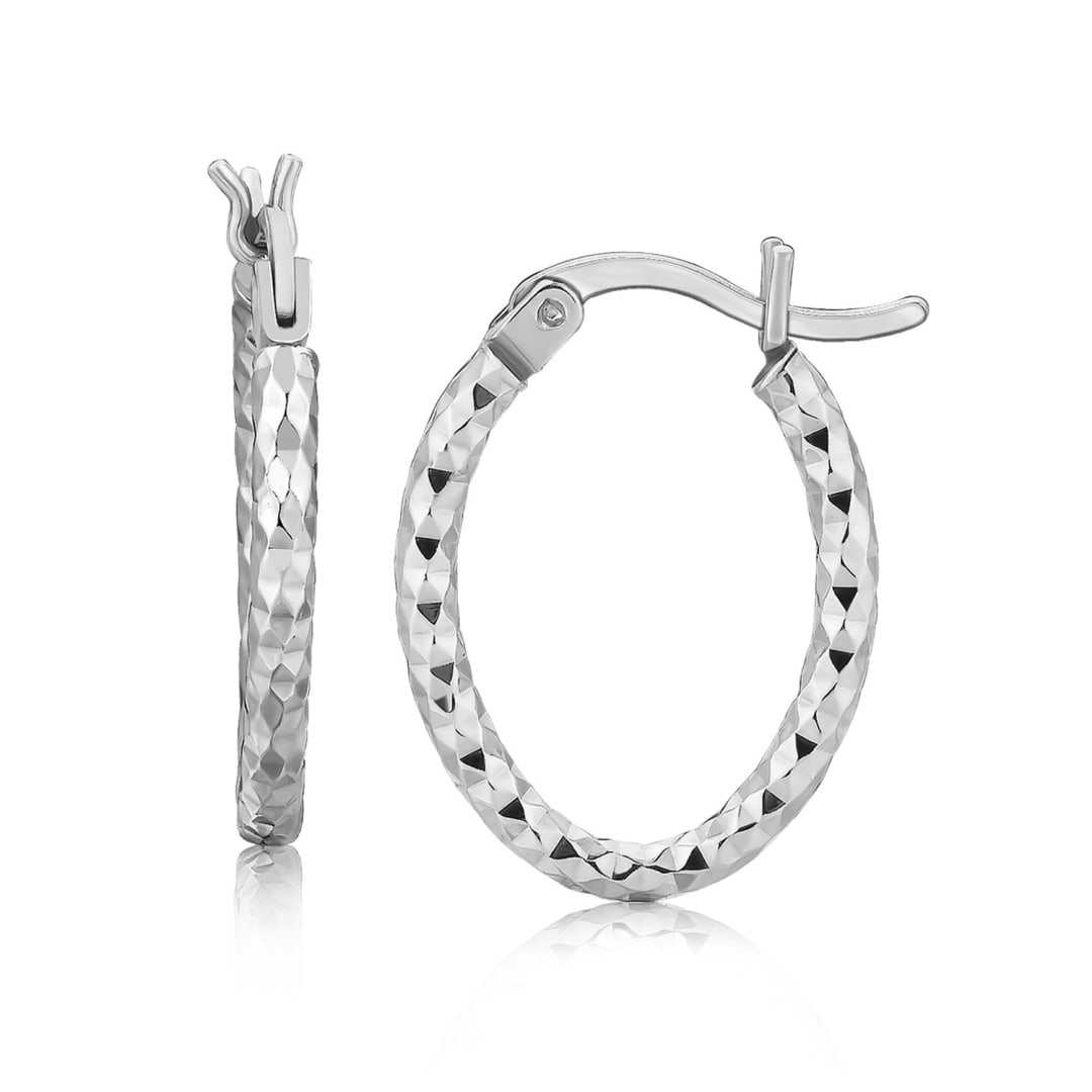 Sterling Silver Diamond Cut Oval Hoop Earrings: Delicate in style, this pair of oval hoop earrings showcases faceted design diamond cuts and gorgeous rhodium plating. Secured with classic snap locks. Earring information: diameter: 10. 00 mm, width: