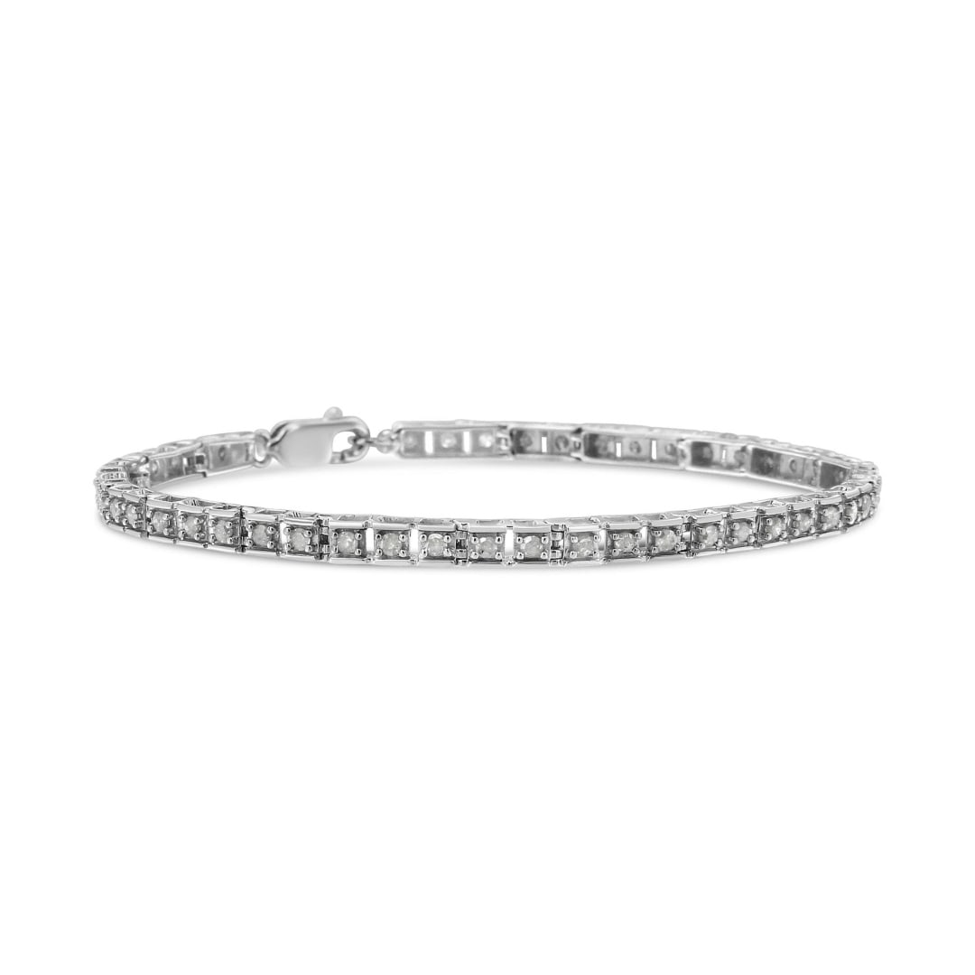 Dazzling 1.01ct Diamond Hybrid Tennis Bracelet: Length: 7". This exquisite tennis bracelet features 50 natural round-cut diamonds, securely set in a prong setting. The diamonds have a clarity range of i2-i3 and a color range of i-j, offering a subt