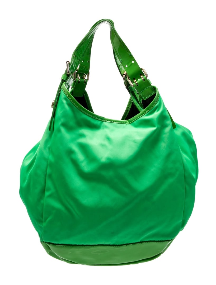 Givenchy Patent Leather Green Nylon Shldr Bag: Condition is good, pre-owned. Details: green nylon, multitonal hardware, patent leather trim, dual adjustable shoulder straps, canvas lining & four interior pockets, snap closure at top, includes dust