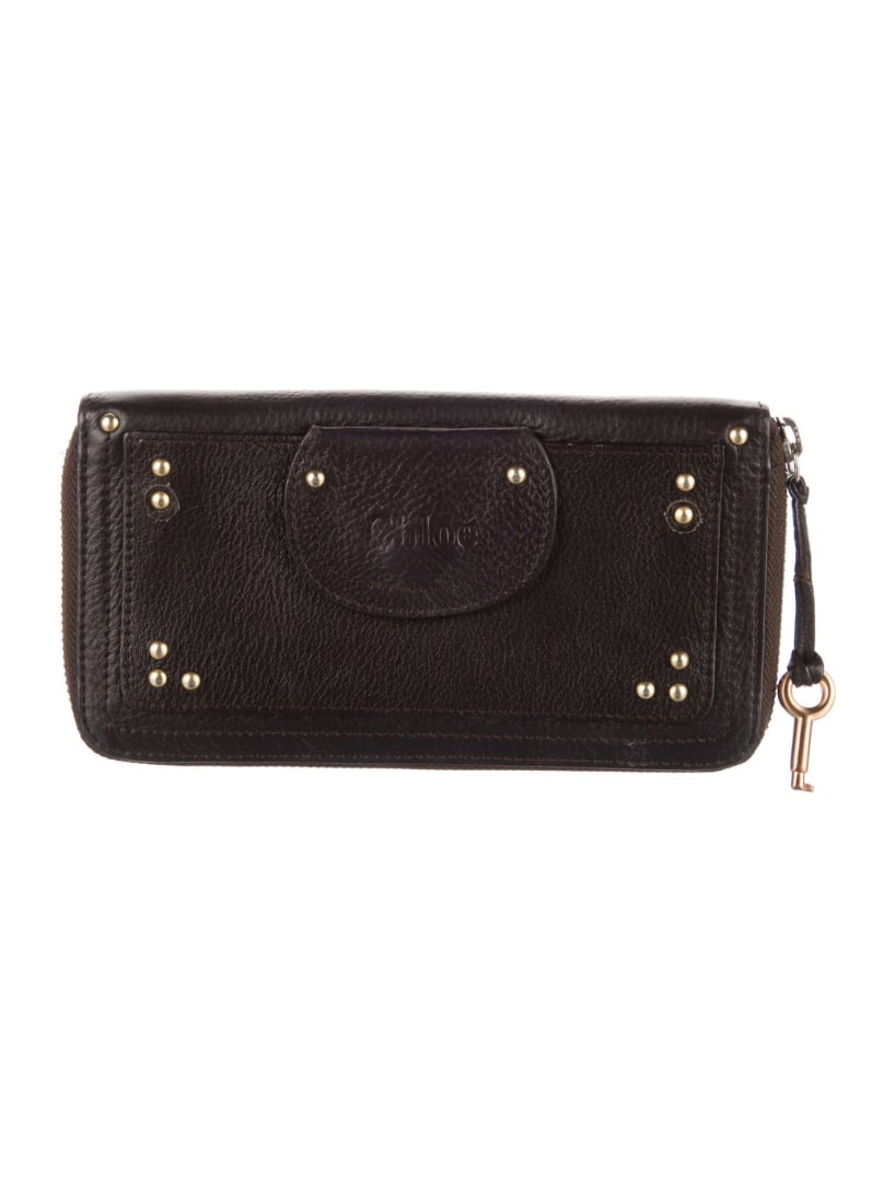 Chloe Brown Leather Studded Wallet: Condition is very good, pre-owned. Details: brown leather, gold-tone hardware, studded accents & single exterior pocket, canvas lining & single interior pocket with card slots, exposed zip closure, in