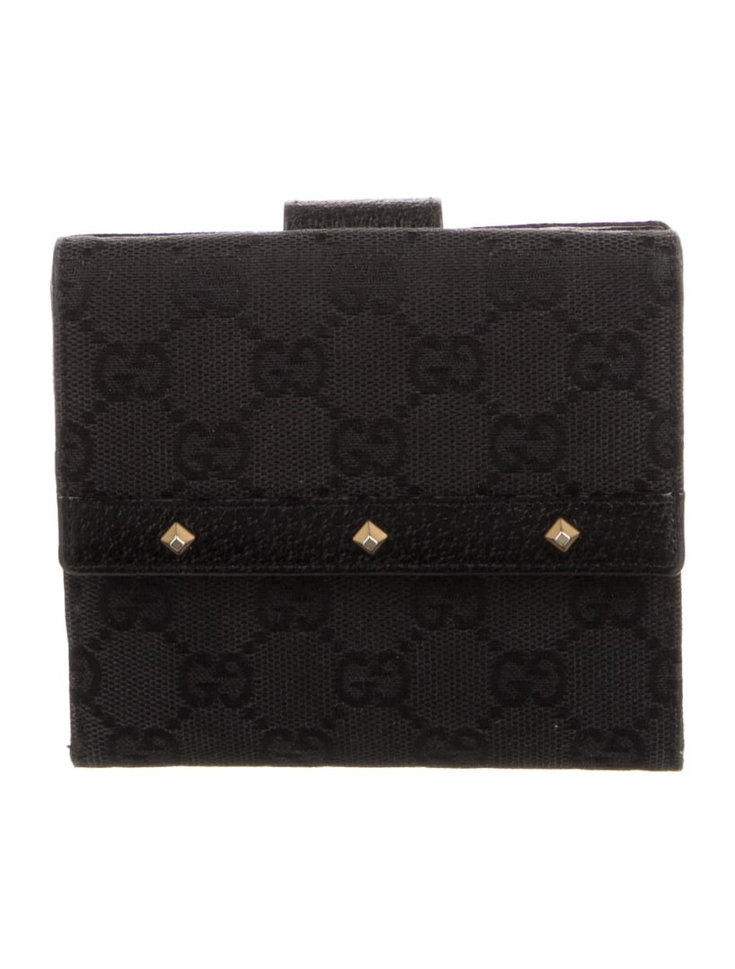 Gucci Black Canvas Studded Snap Compact Wallet: Condition is very good, pre-owned. Details: black canvas, gg canvas, gold-tone hardware, studded accents & single exterior pocket, leather lining & three interior pockets with card slots, snap closure