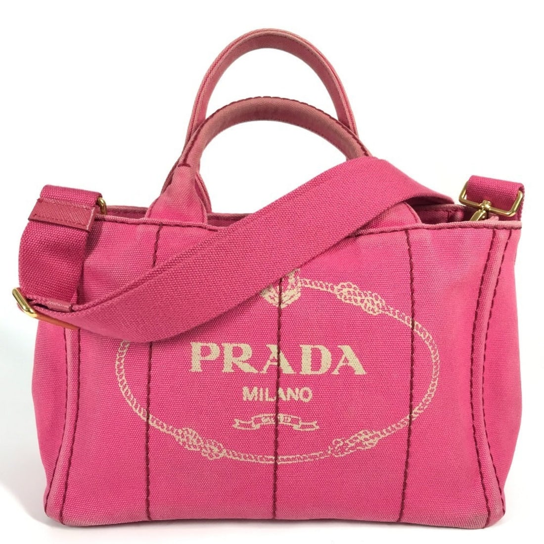 Prada Canapa Pink Canvas Medium Top Handle Bag: Condition is good, pre-owned. Details - condition details: some light signs of wear. Slight scratches, slight dirt. Size and fit: 10. 62"w x 7. 08"h x 5. 51"d, 12-21. 5" strap drop, 6" handle drop. Ex