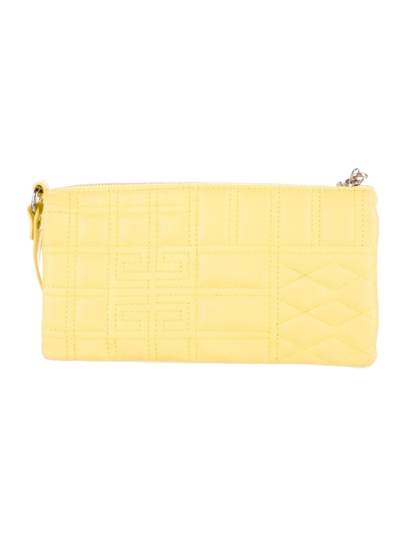 Givenchy Yellow Leather Embroidered Snap Pouch: Condition is very good, pre-owned. Details: yellow leather, silver-tone hardware, single shoulder strap, embroidered accent, grosgrain lining & three interior pockets, snap closure, height: 4. 5", wid