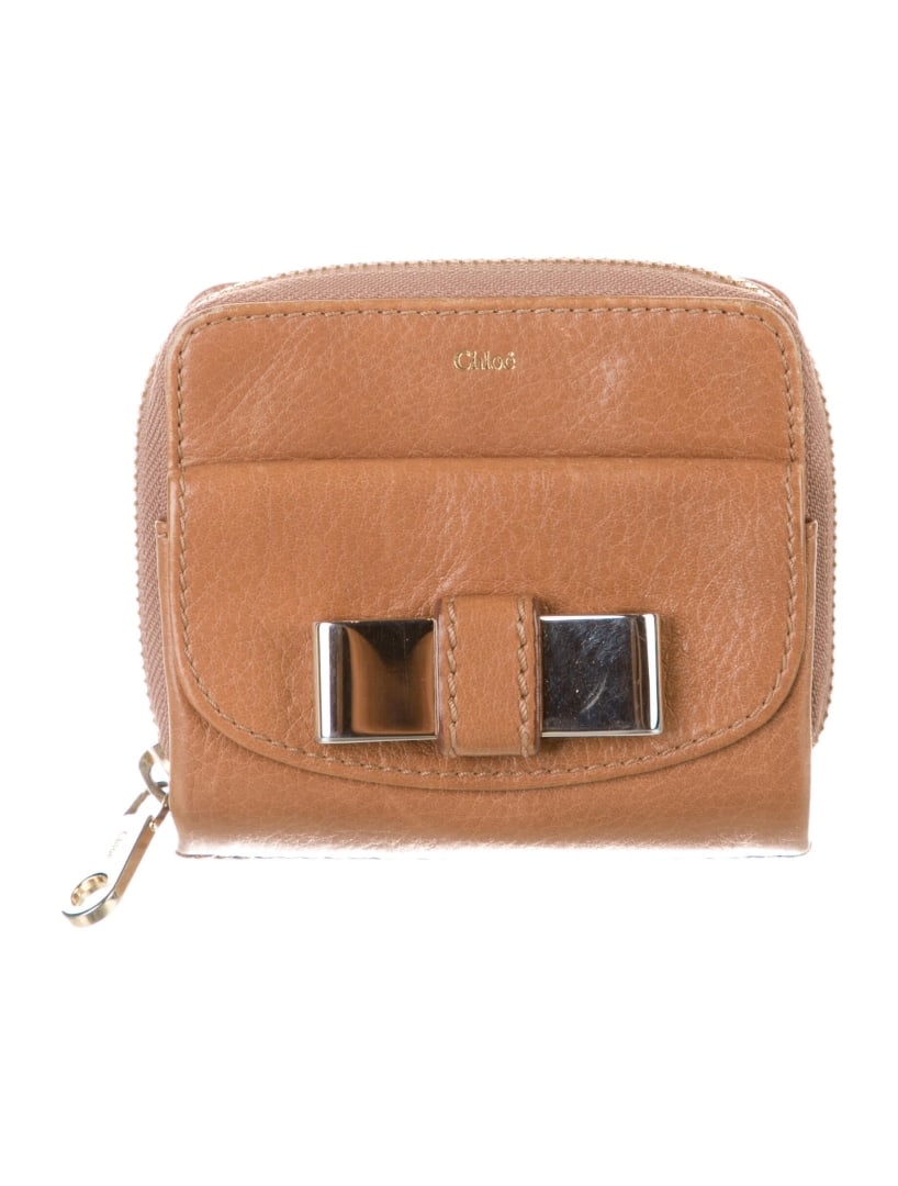 Chloe Brown Leather Gold-tone Hardware Wallet: Condition is very good, pre-owned. Details: brown leather, gold-tone hardware, single exterior pocket, canvas lining with card slots, exposed zip closure, height: 4", width: 4. 25", depth: 1. 25", gen