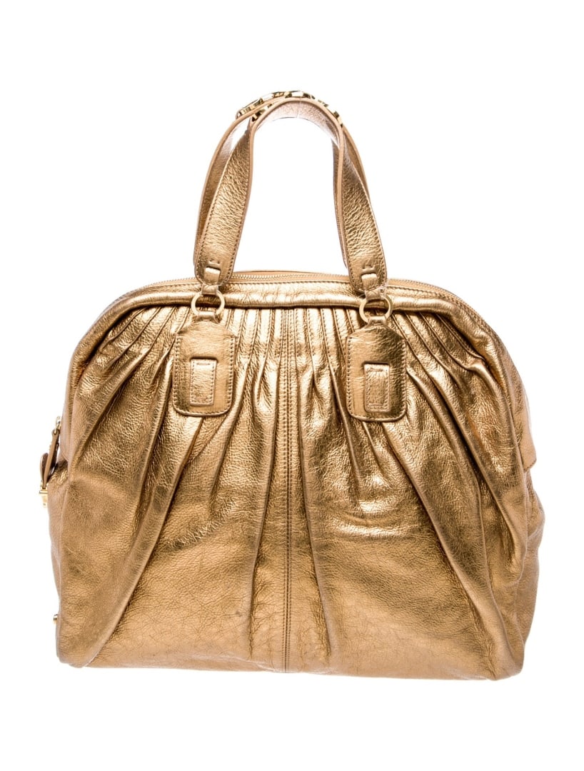 Roberto Cavalli Gold Leather Zip Top Handle Bag: Condition is good, pre-owned. Details: gold leather, gold-tone hardware, flat handles, canvas lining & four interior pockets, zip closure at top, protective feet at base, handle drop: 5. 25", height: