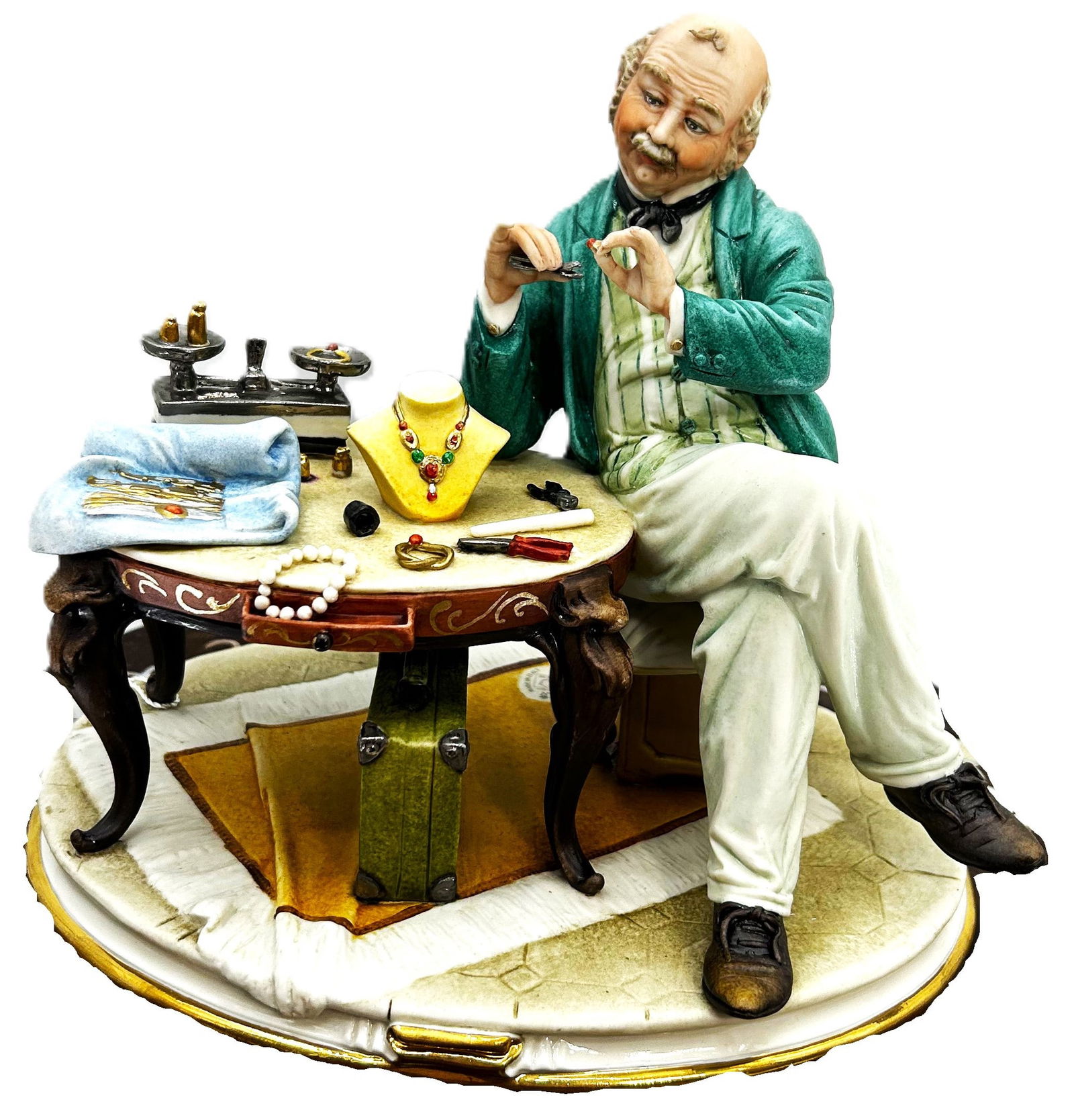 Jewelry Craftsman: A finely detailed Capodimonte porcelain figurine depicting a master craftsman meticulously working on exquisite jewelry.