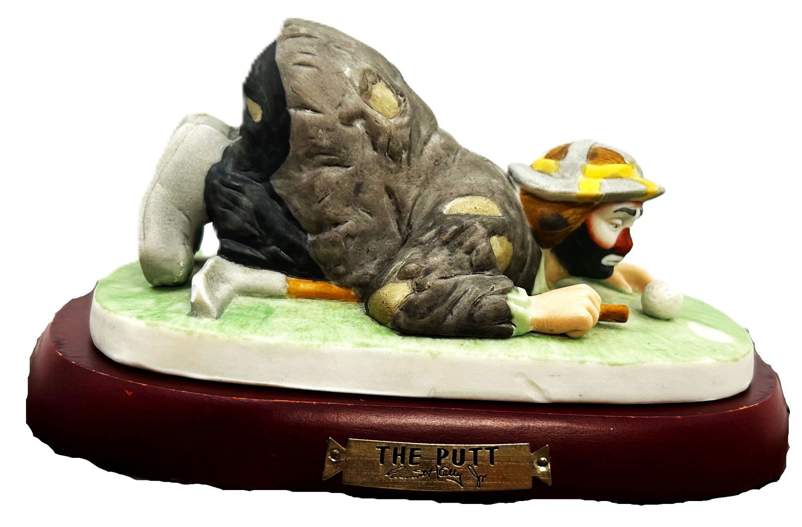 The Putt: This whimsical Capodimonte figurine captures the spirit of a clown on the golf course.