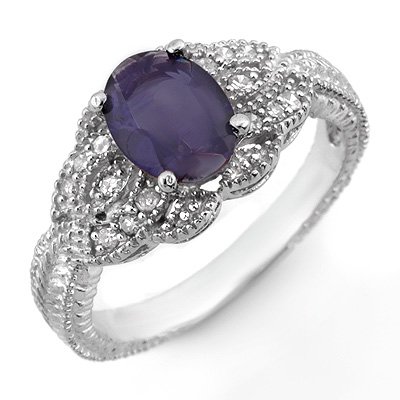 ACA Certified 1.35ctw Diamond & Iolite Ring 14K Gold: Lot no.: 1857 1.35 ctw DIAMOND & IOLITE LADIES VINTAGE RING IN 14K WHITE GOLDGEMSTONE: 1 OVAL CUT IOLITE 1.10 ctwDIAMOND: 14 ROUND DIAMONDS 0.25 ctwCLARITY: SI2-I1COLOR: H-KGOLD WEIGHT: APPROXIMATELY