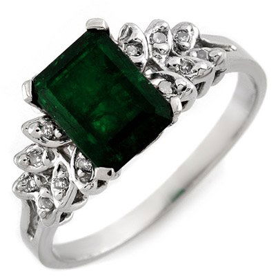 Genuine 2.12ctw Diamond & Emerald Ring White Gold: Lot no.: 1687 GENUINE 2.12 ctw DIAMOND & EMERALD LADIES RING IN 10K WHITE GOLDGEMSTONE: 1 EMERALD CUT EMERALD 2.00 ctwDIAMOND: 12 ROUND CUT 0.12 ctwCLARITY: SI2-I1COLOR: H-KGOLD WEIGHT: APPROXIMATELY