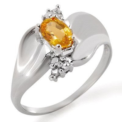 Ring 0.79ctw ACA Certified Diamond & Yellow Sapphire: Lot no.: 1804 SOLITAIRE 0.79 ctw DIAMOND & YELLOW SAPPHIRE LADIES RING IN 10KT WHITE GOLDGEMSTONE: 1 OVAL CUT YELLOW SAPPHIRE 0.75 ctwDIAMOND: 2 ROUND CUT 0.04 ctwCLARITY: SI3-I2COLOR: H-KGOLD WEIGHT: