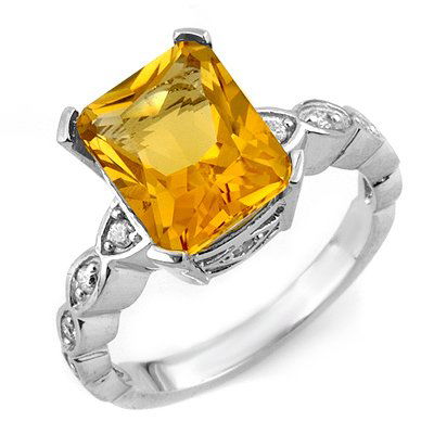 Fine 4.25ctw ACA Certified Diamond & Citrine Ring Gold: Lot no.: 1466 GENUINE 4.25 ctw DIAMOND & CITRINE LADIES RING IN 10K WHITE GOLD GEMSTONE: 1 EMERALD CUT CITRINE 4.00 ctwDIAMOND: 12 ROUND CUT 0.25 ctwCLARITY: SI2-I1COLOR: H-KGOLD WEIGHT: APPROXIMATELY